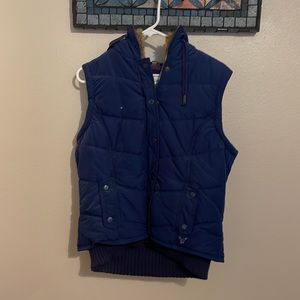 Blue vest with brown fur inside